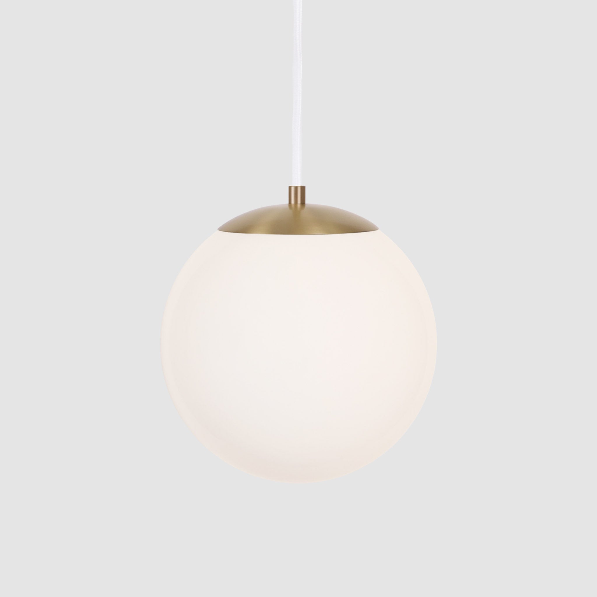 Alto Cord 10" shown in Brass with White Cloth Cord and an Opal 10” Globe