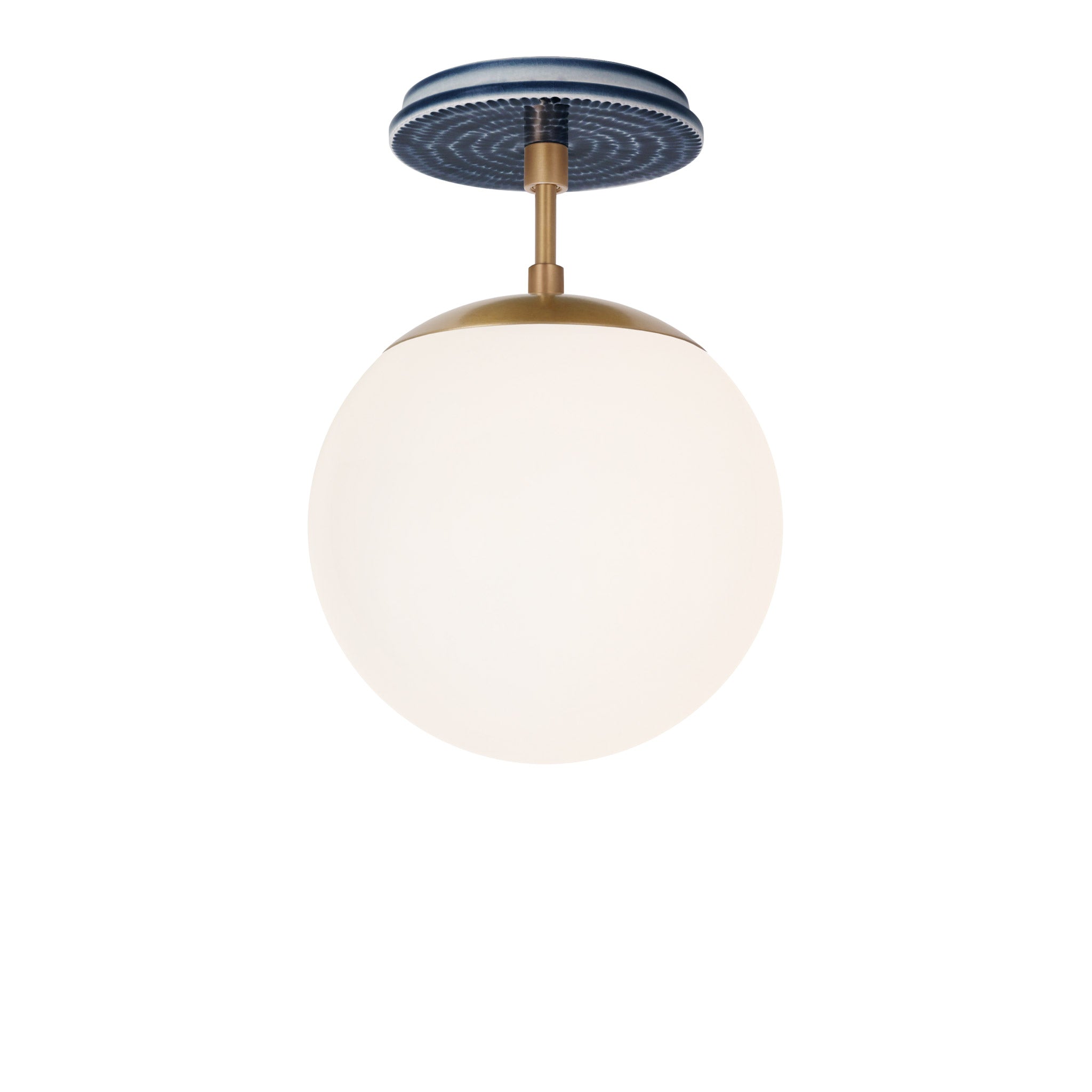 Alto Surface 8" shown in Heirloom Brass with an Indigo Blue Sunflower Ceramic Canopy
