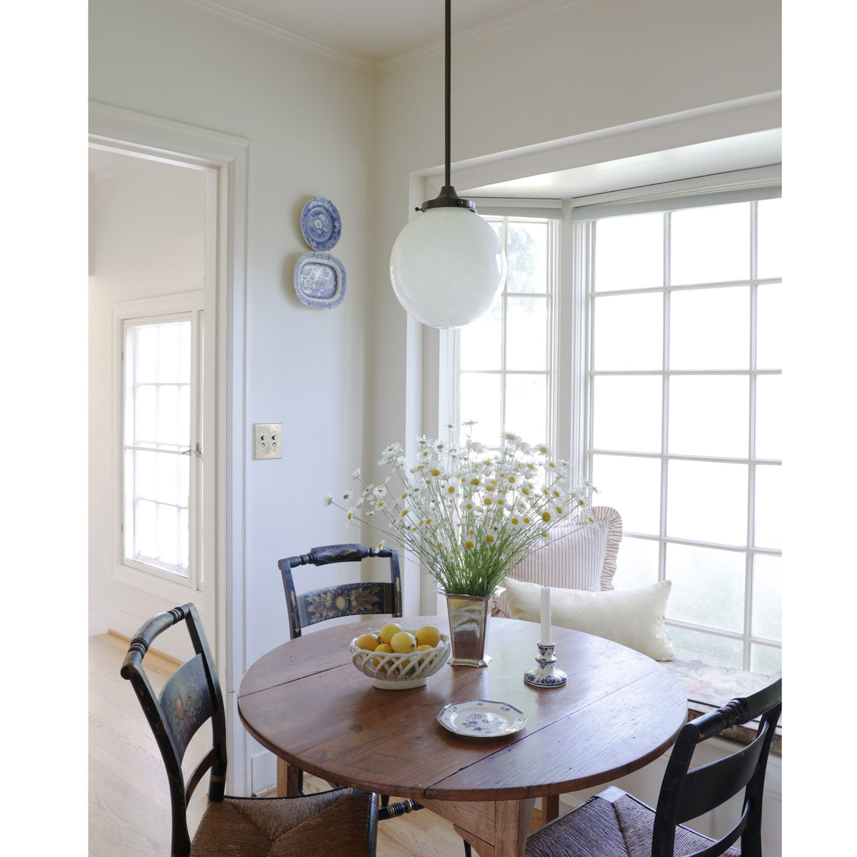 Bijou Pendant 10" Globe shown in Graphite Patina. Interior design by Sarah J. Meyer Design