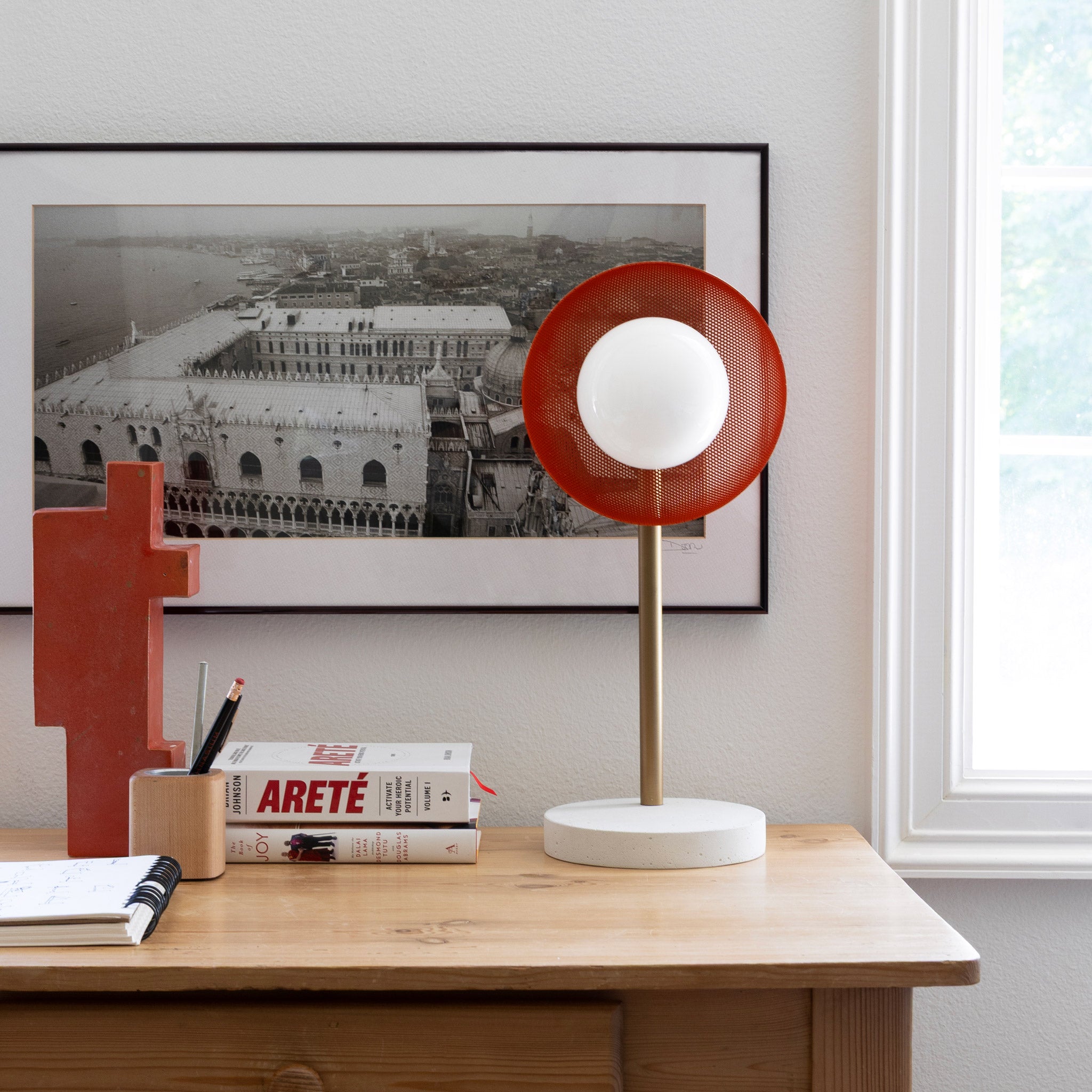 Lexi Lamp shown with a perforated Persimmon shade