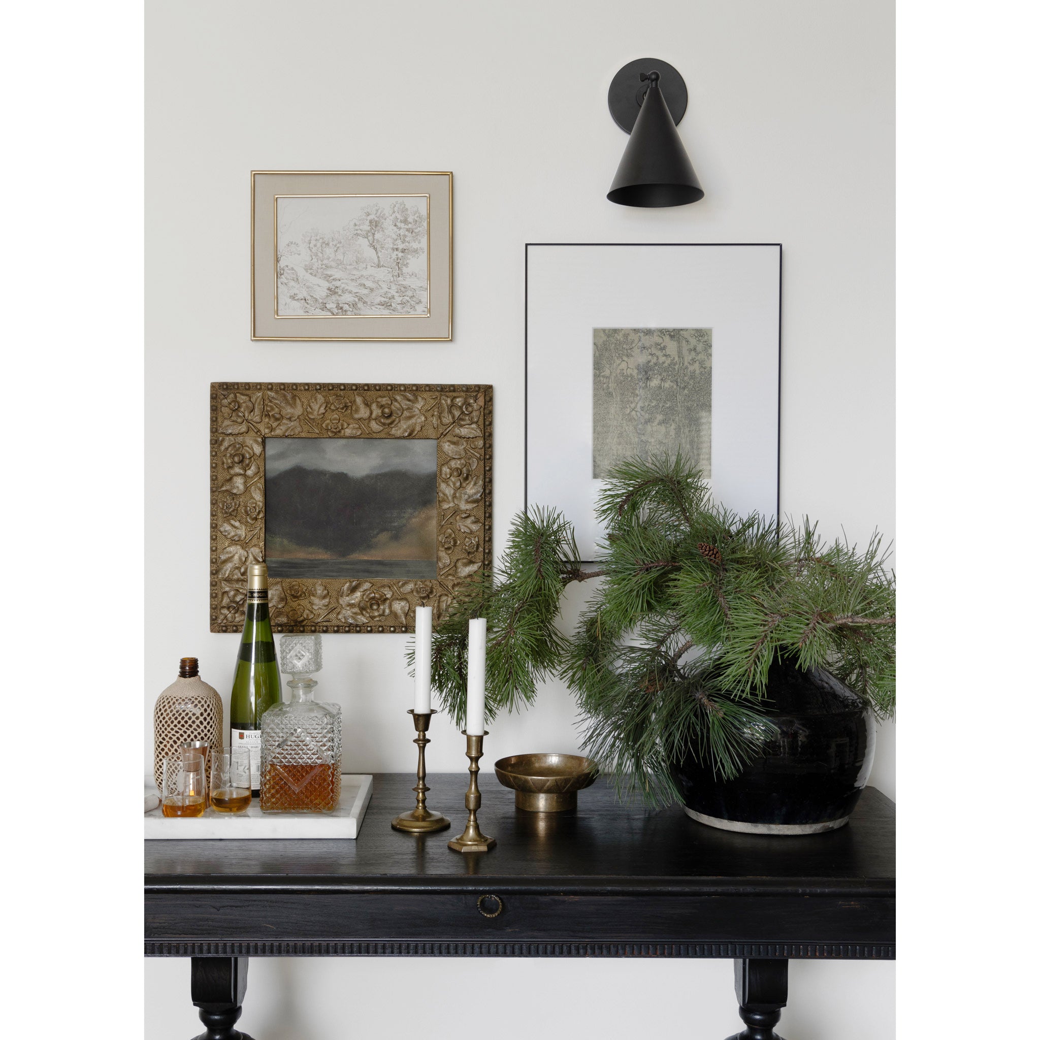 Petra Sconce shown in Matte Black with a 3" arm
