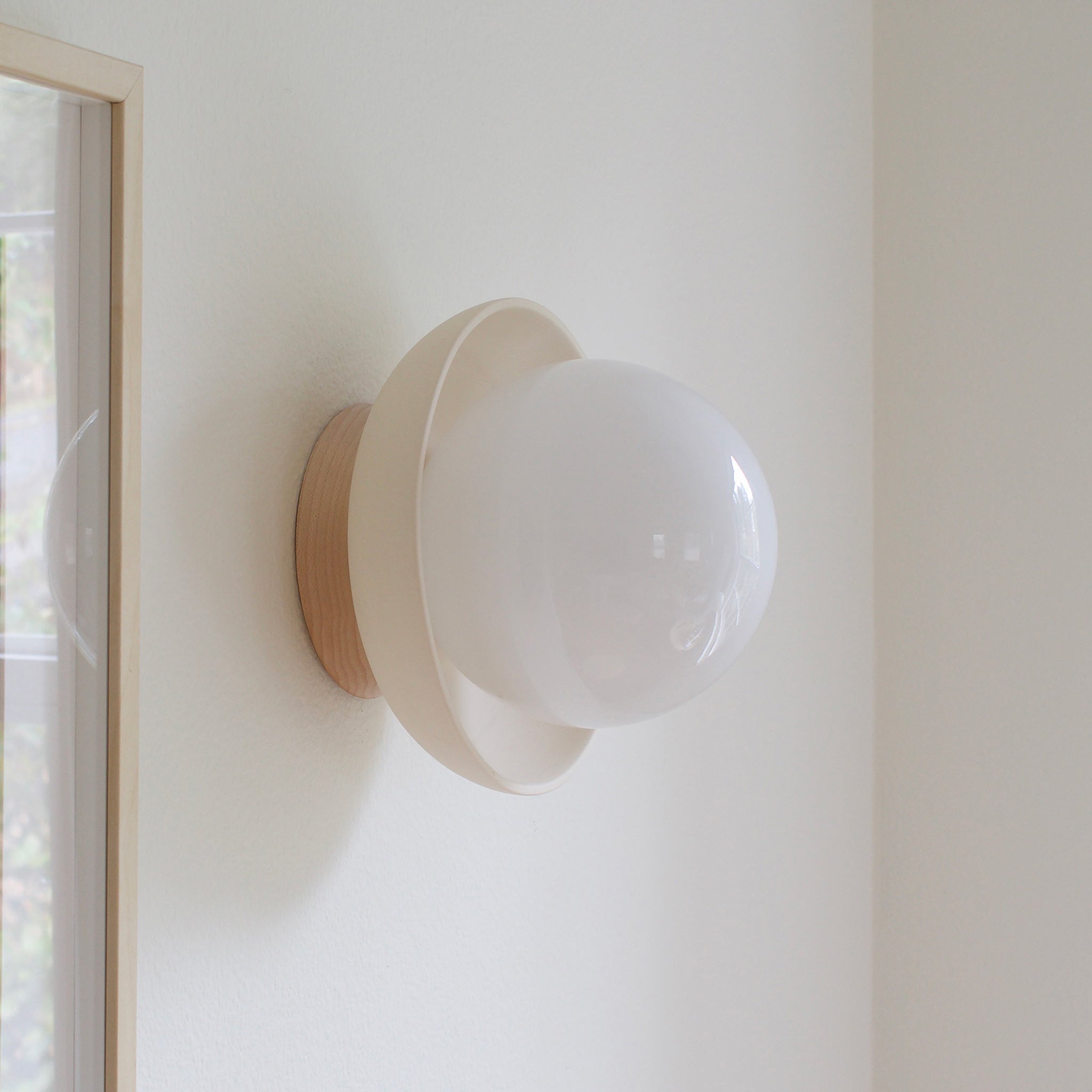 Terra Lexi shown in Bone ceramic and Maple wood canopy