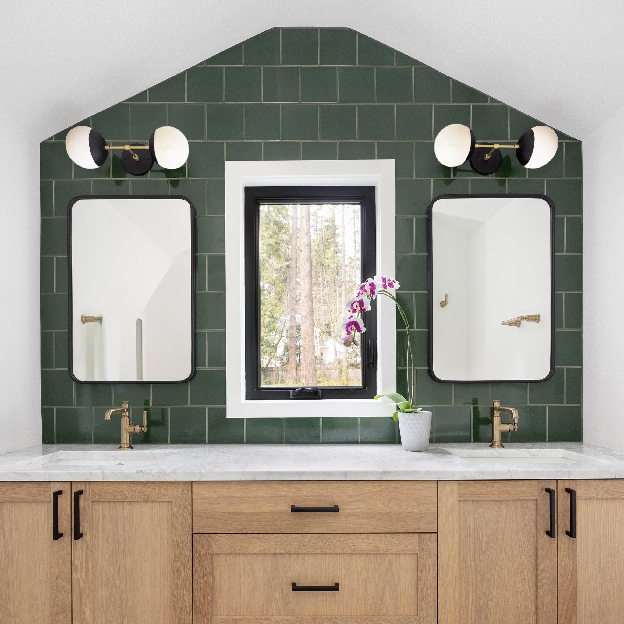 Theo Sconces in Matte Black with Brass. Interior Design by Anna West. Photography by Meagan Larson