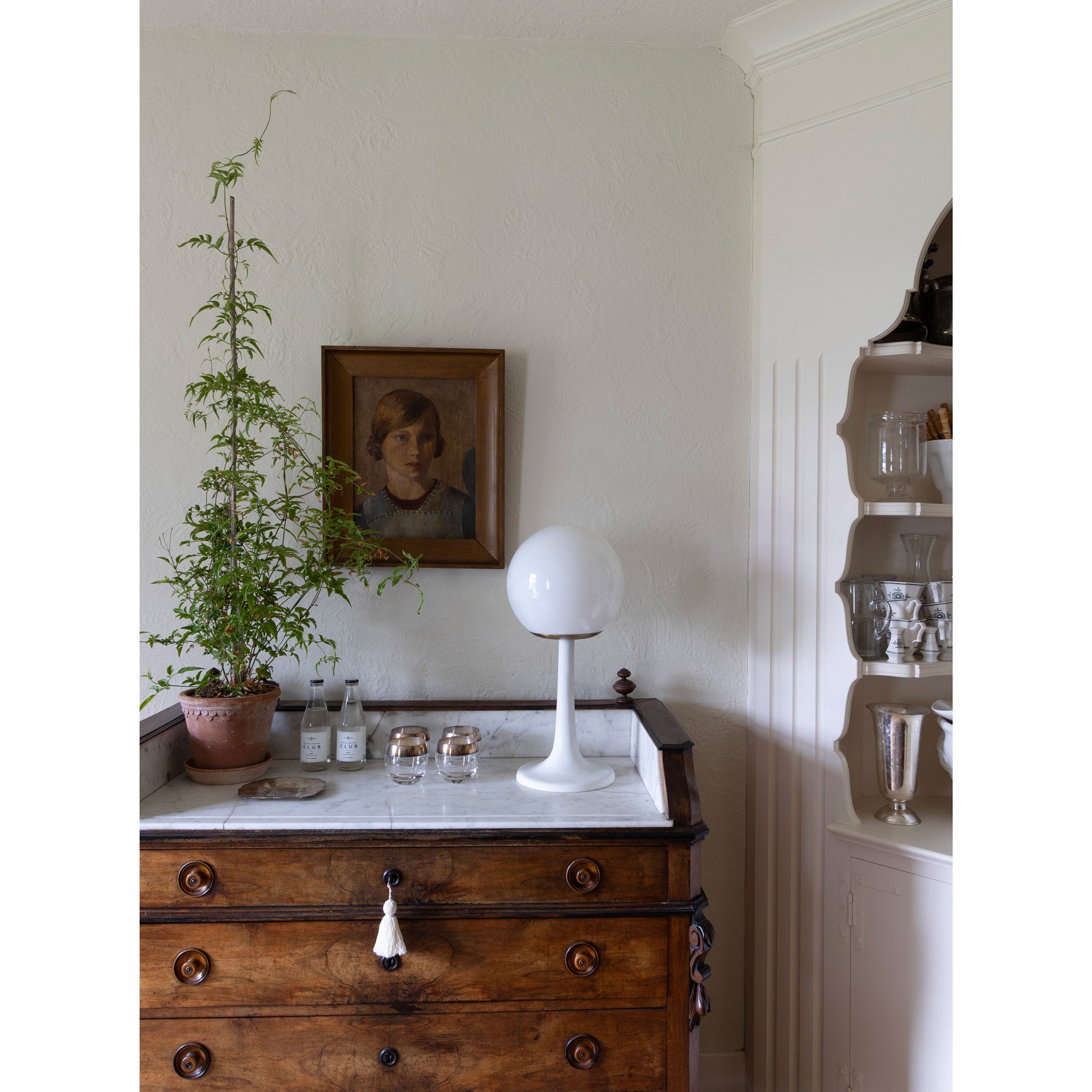 Aaro Lamp shown in Heirloom Brass. Interior design by Sarah J. Meyer Design