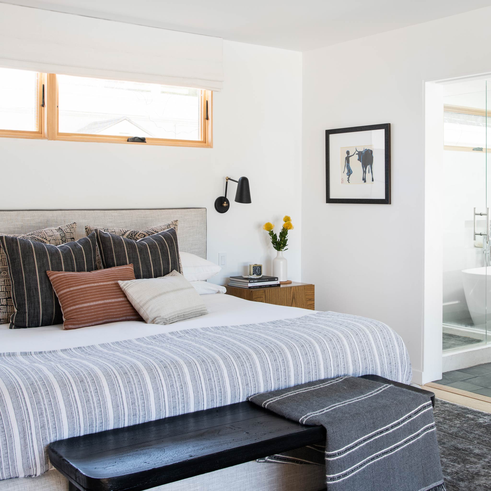 Wildwood Double Articulated in Matte Black with Brass Accents. Interior Design by Carly Waters. Photo by Tessa Neustadt