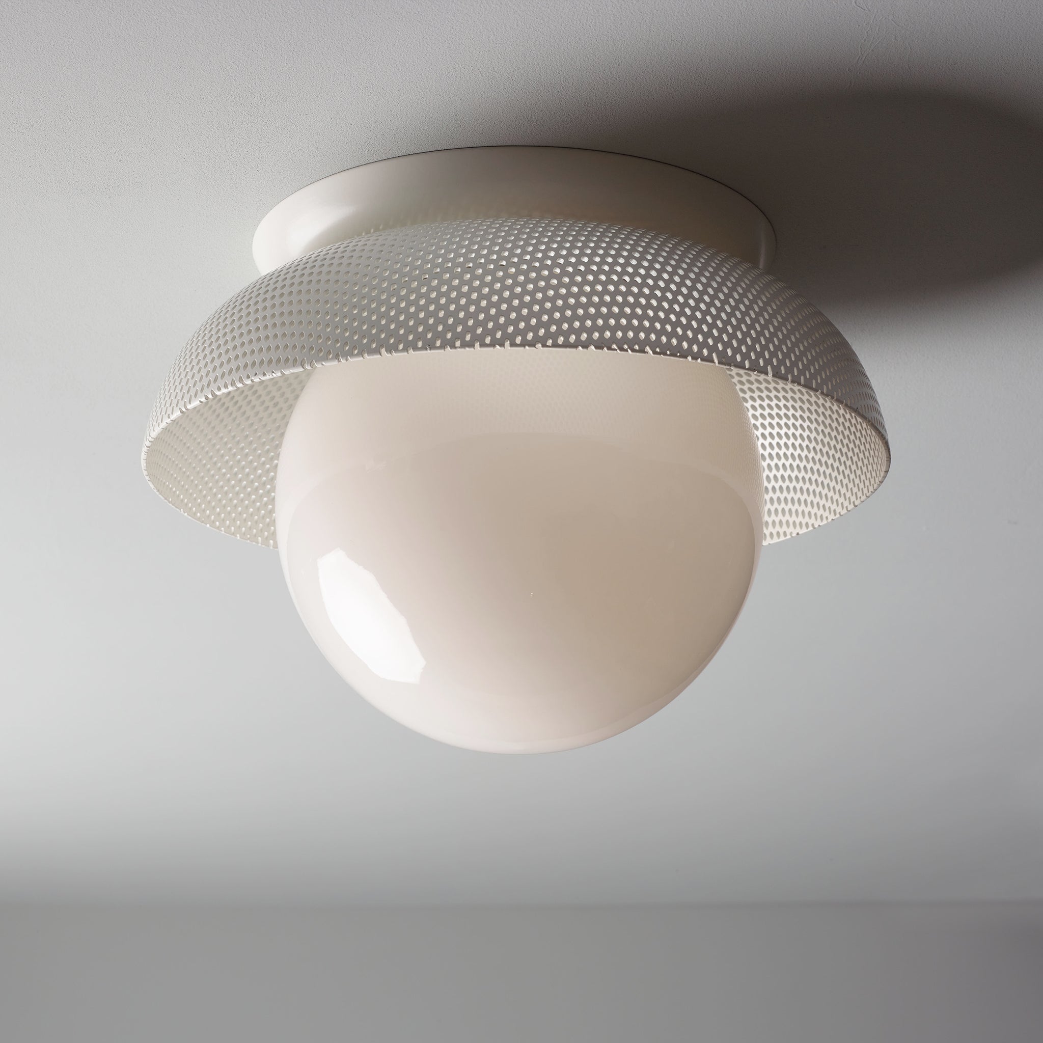 Lexi Large 8” shown with a Perforated shade in White and White Metal finish canopy
