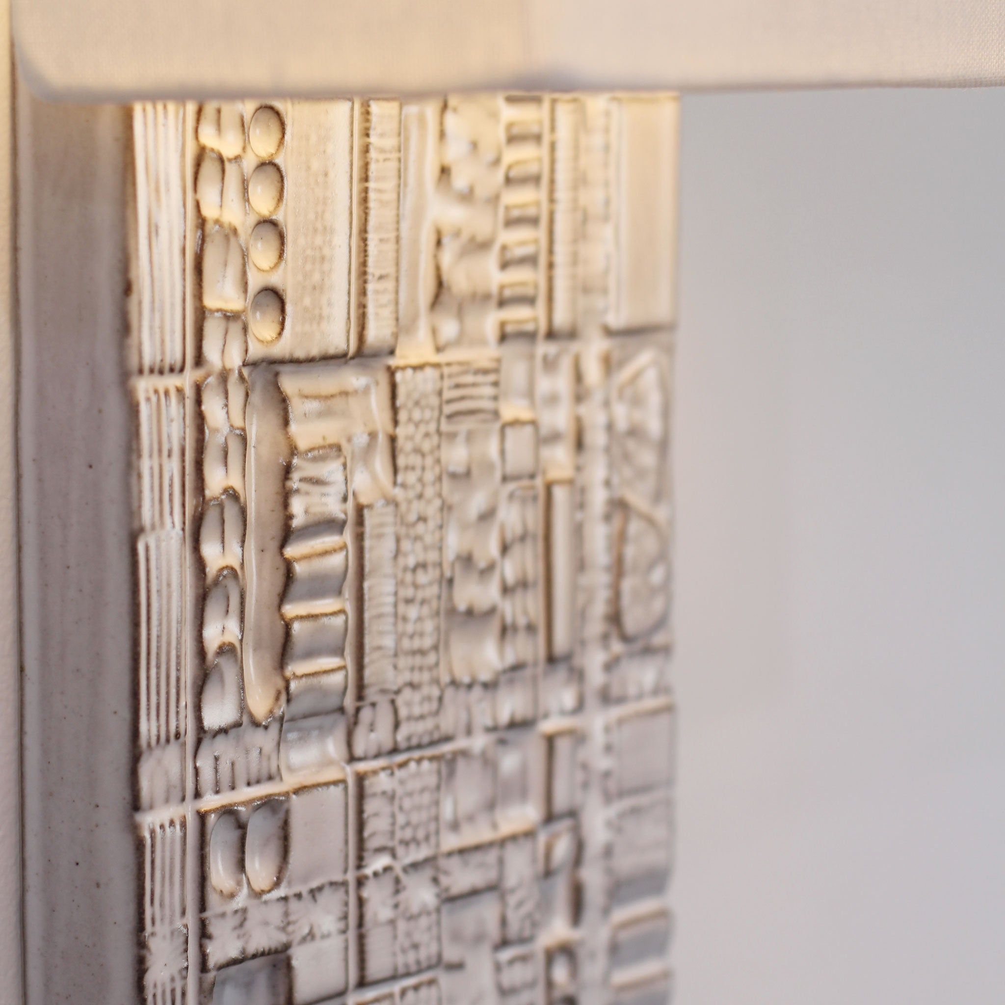 Izzy Sconce shown in Brownstone White