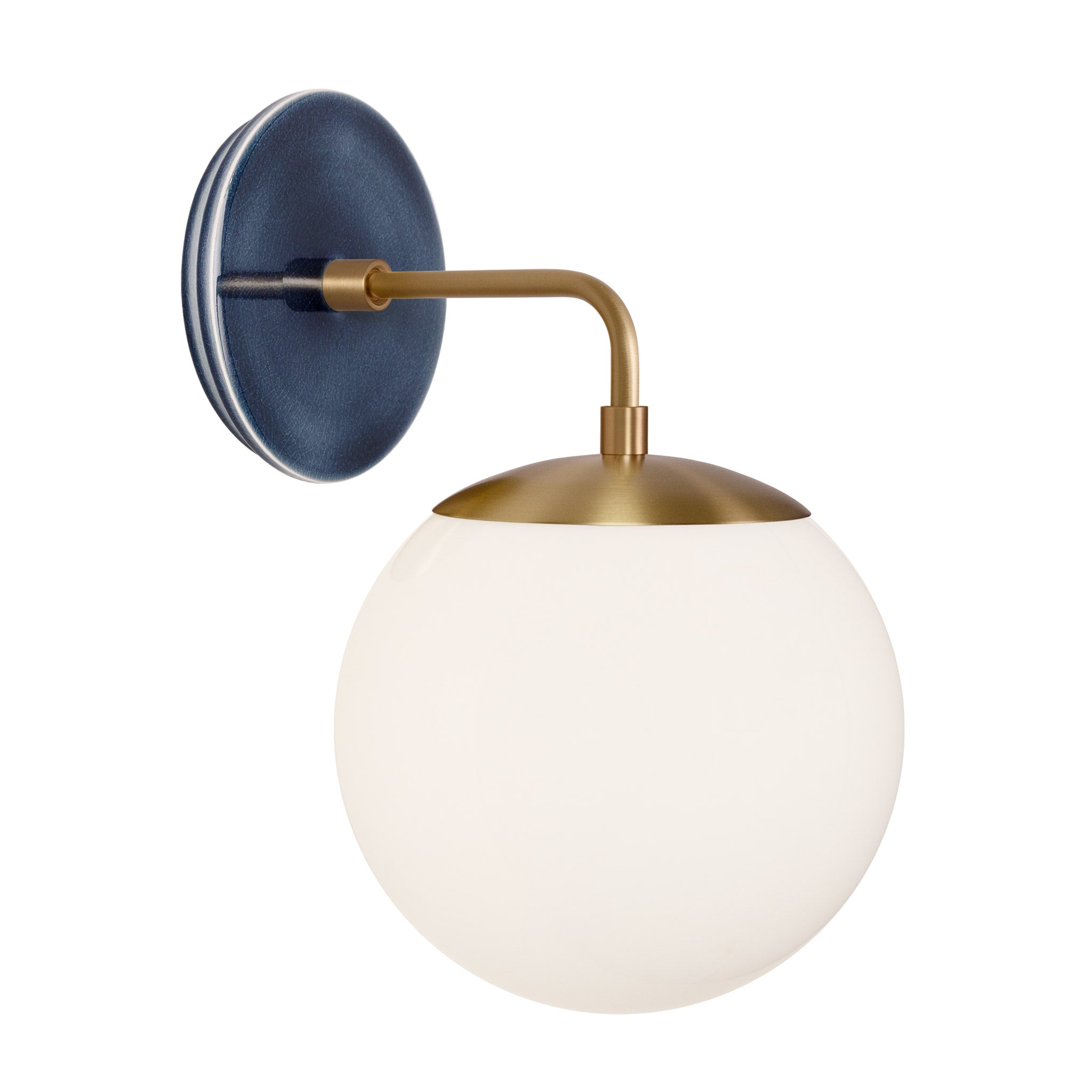 Alto Sconce 8” shown in Heirloom Brass with an Indigo Blue Swift Ceramic Canopy