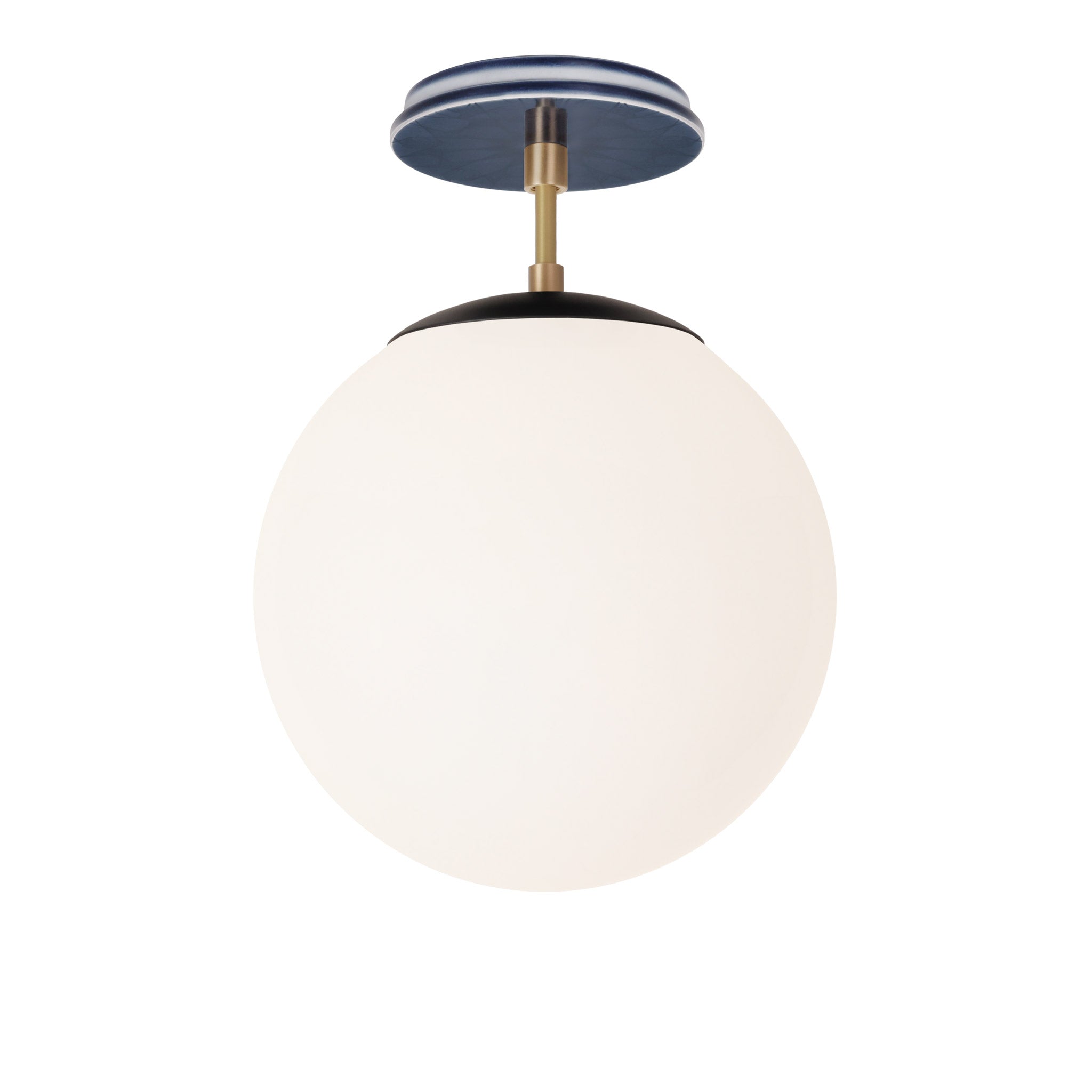 Alto Surface 10” shown in Matte Black with Brass and an Indigo Blue Star Ceramic Canopy