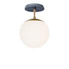 Alto Surface 8" shown in Heirloom Brass with an Indigo Blue Sunflower Ceramic Canopy