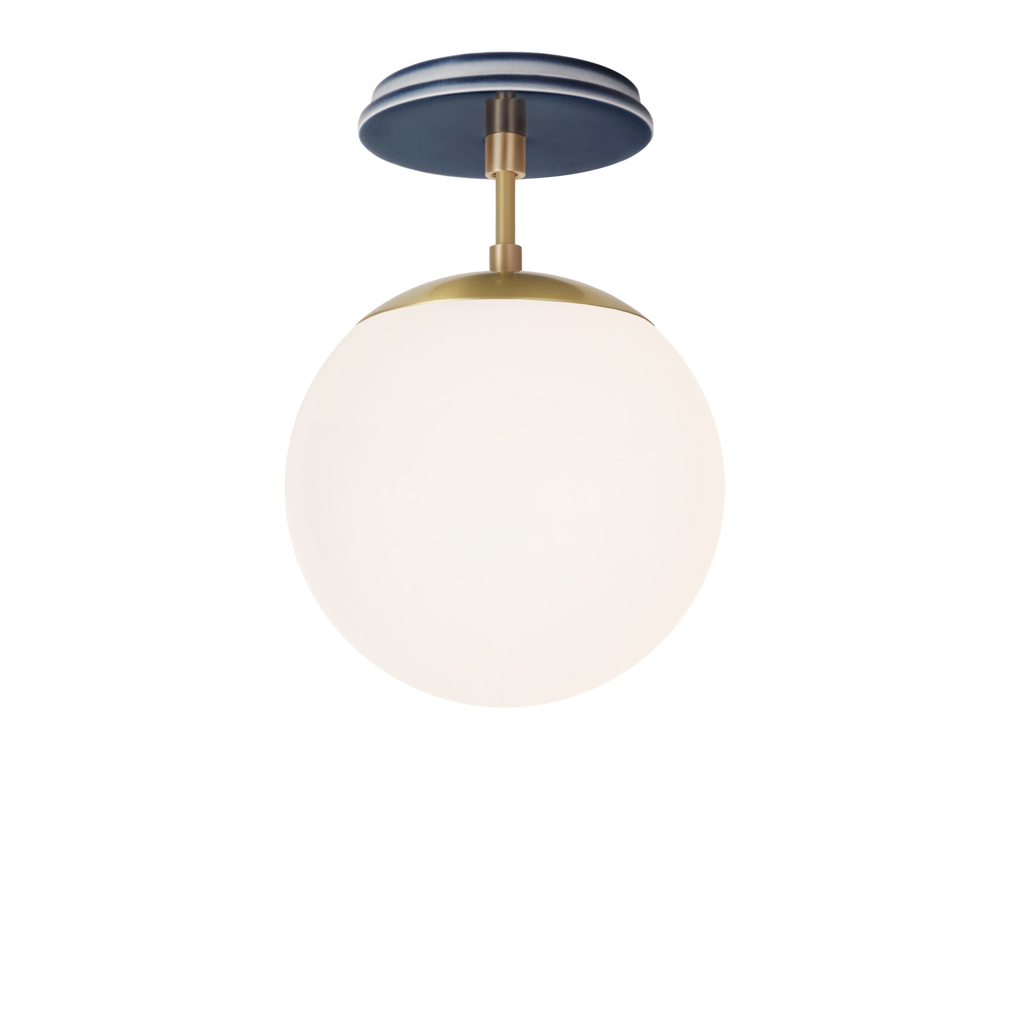 Alto Surface 8" shown in Brass with an Indigo Blue Swift Ceramic Canopy