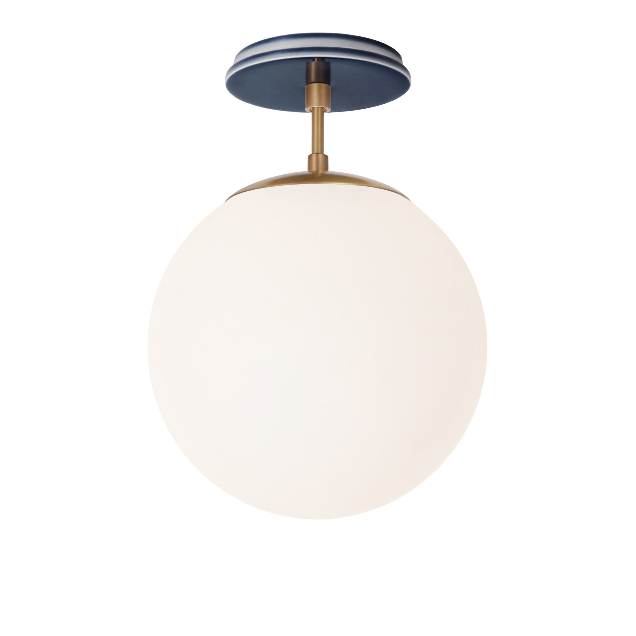Alto Surface 10” shown in Heirloom Brass with an Indigo Blue Swift Ceramic Canopy