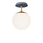 Alto Surface 8" shown in Heirloom Brass with an Indigo Blue Swift Ceramic Canopy