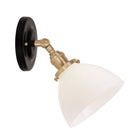 Grace Flush Sconce shown in Brass with a Gloss Black Ceramic canopy and Opal Glass shade