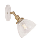 Grace Flush Sconce shown in Brass with a Gloss White Ceramic canopy and Clear Glass shade