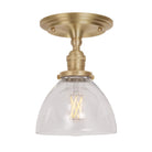 Grace Surface shown in Brass with a Clear Glass shade