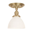 Grace Surface shown in Brass with an Opal Glass shade