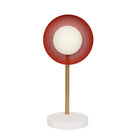 Lexi Lamp shown with a perforated Persimmon shade