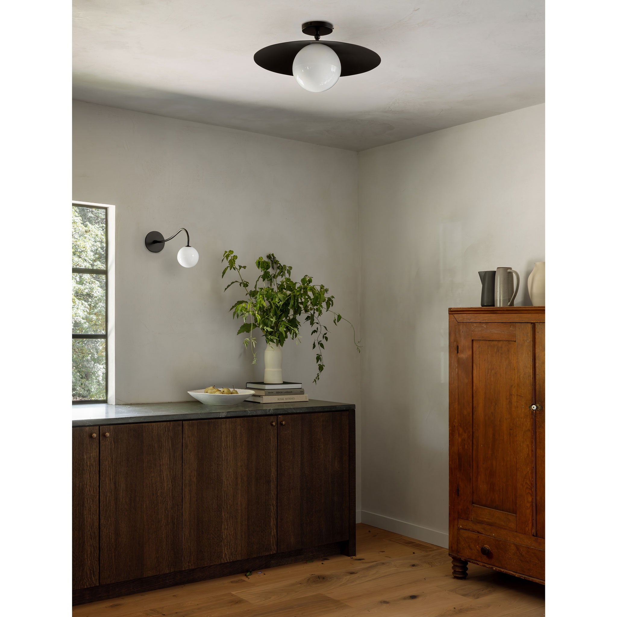 Marie Majeure Surface shown in Matte Black with a Josephine Wall Sconce