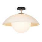 Maru Surface with a Natural shade shown in Heirloom Brass with a Black Stained Wood canopy