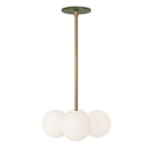 Selene Compass shown in Heirloom Brass with a Secret Garden Green Canopy