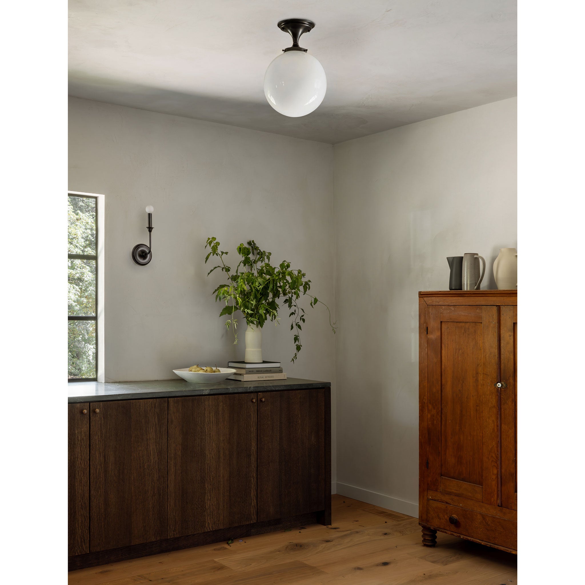 Sorbonne Surface 12" Globe shown in Graphite Patina with a Bijou Candle Wall Sconce