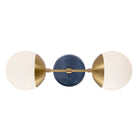 Theo shown in Heirloom Brass with an Indigo Blue Swift Ceramic Canopy
