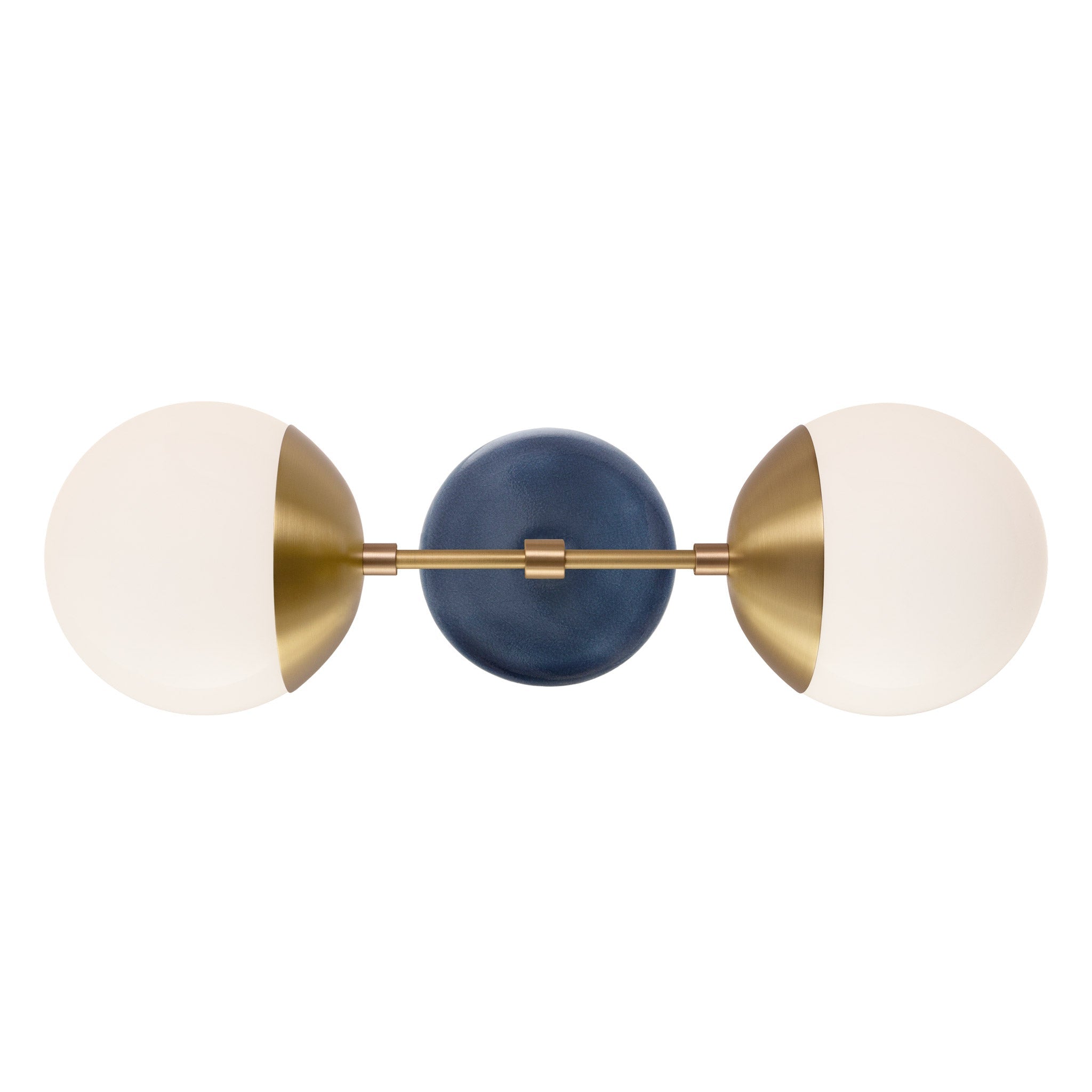 Theo shown in Heirloom Brass with an Indigo Blue Swift Ceramic Canopy