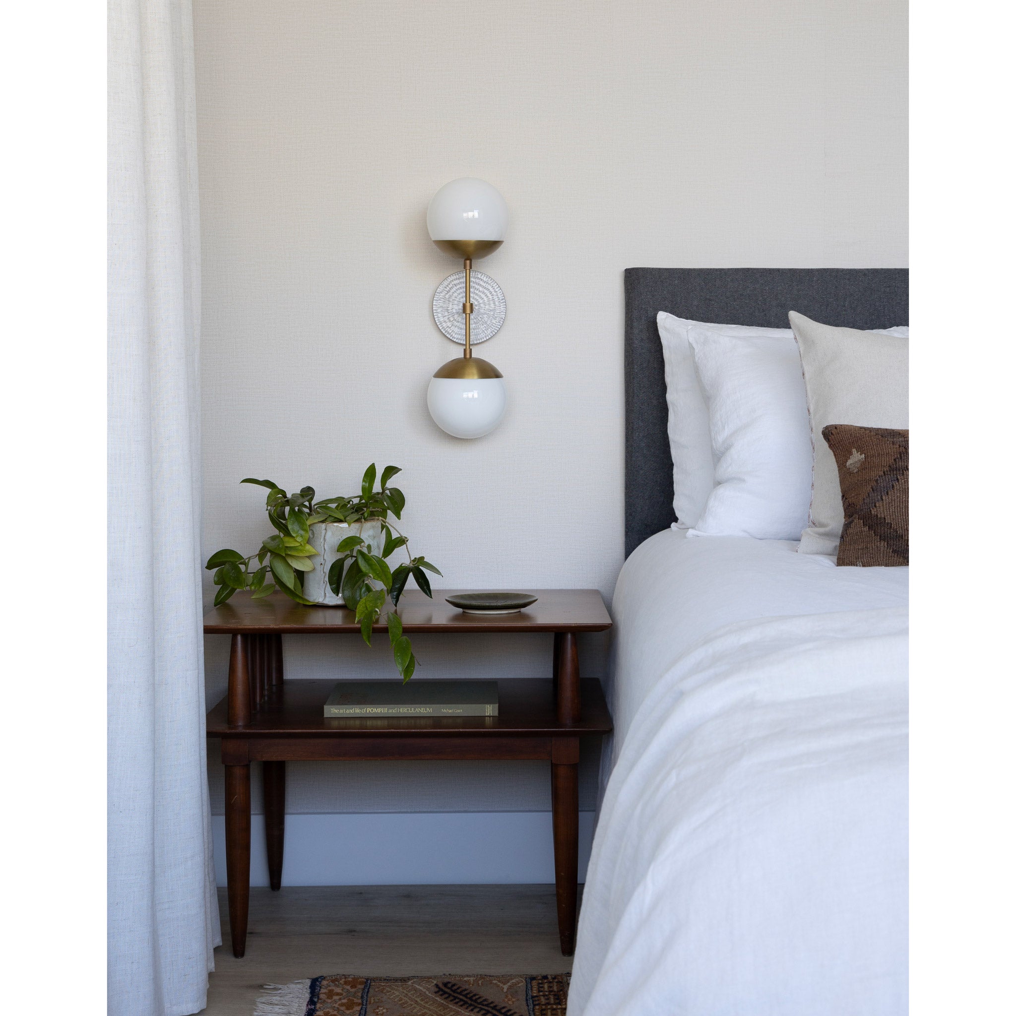 Theo shown in Heirloom Brass with a Brownstone White Sunflower Ceramic Canopy