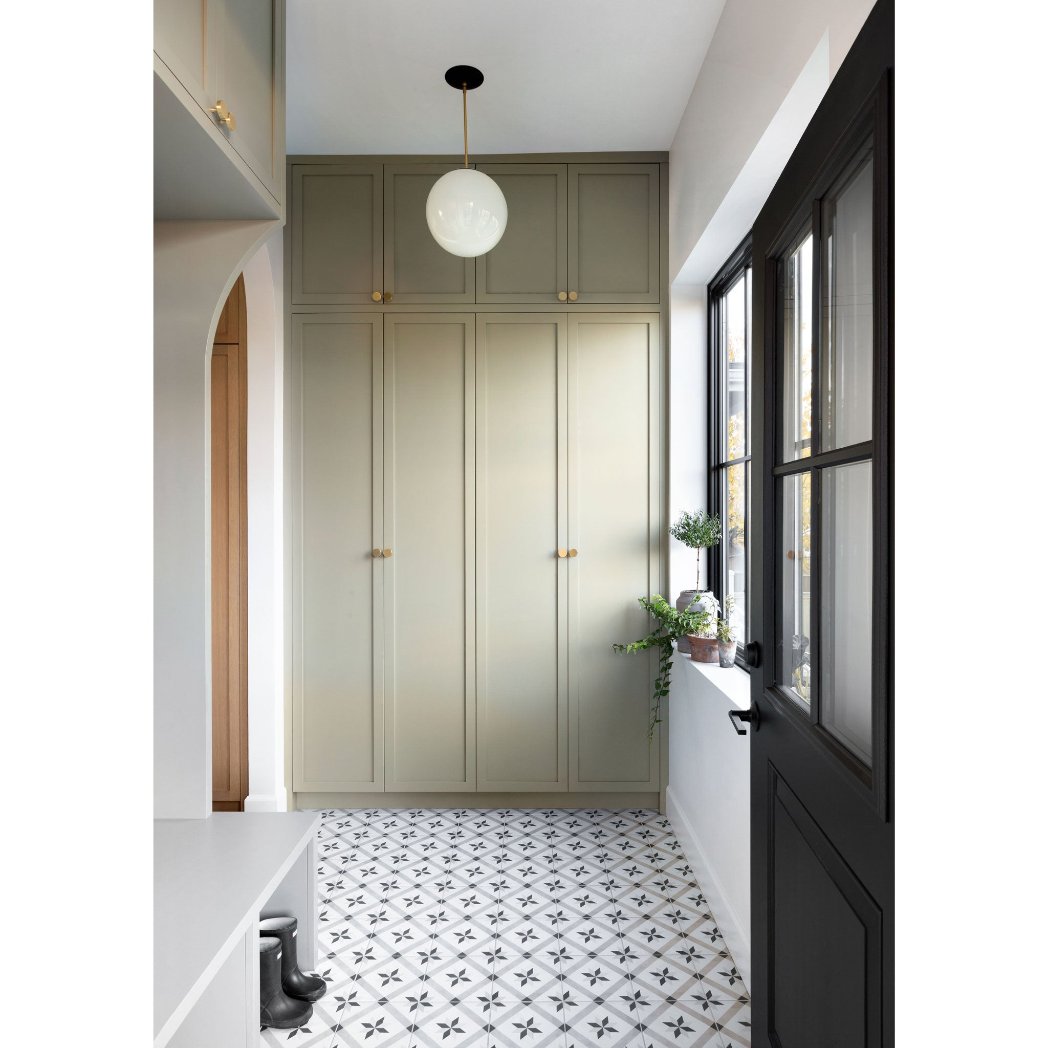 Alto Rod 12" Opal shown in Matte Black with Brass. Interior Design by Shift Interiors. Photography by Tina Kulic of Ema Peter Photo 