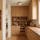 Brass Cutie 8" in Heirloom Brass shown in a modern pantry 