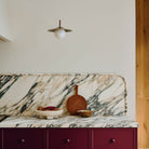 Marie Sconce shown in Heirloom Brass. Interior Design by Sarah Sherman Samuel. Photography by Daniel Peter