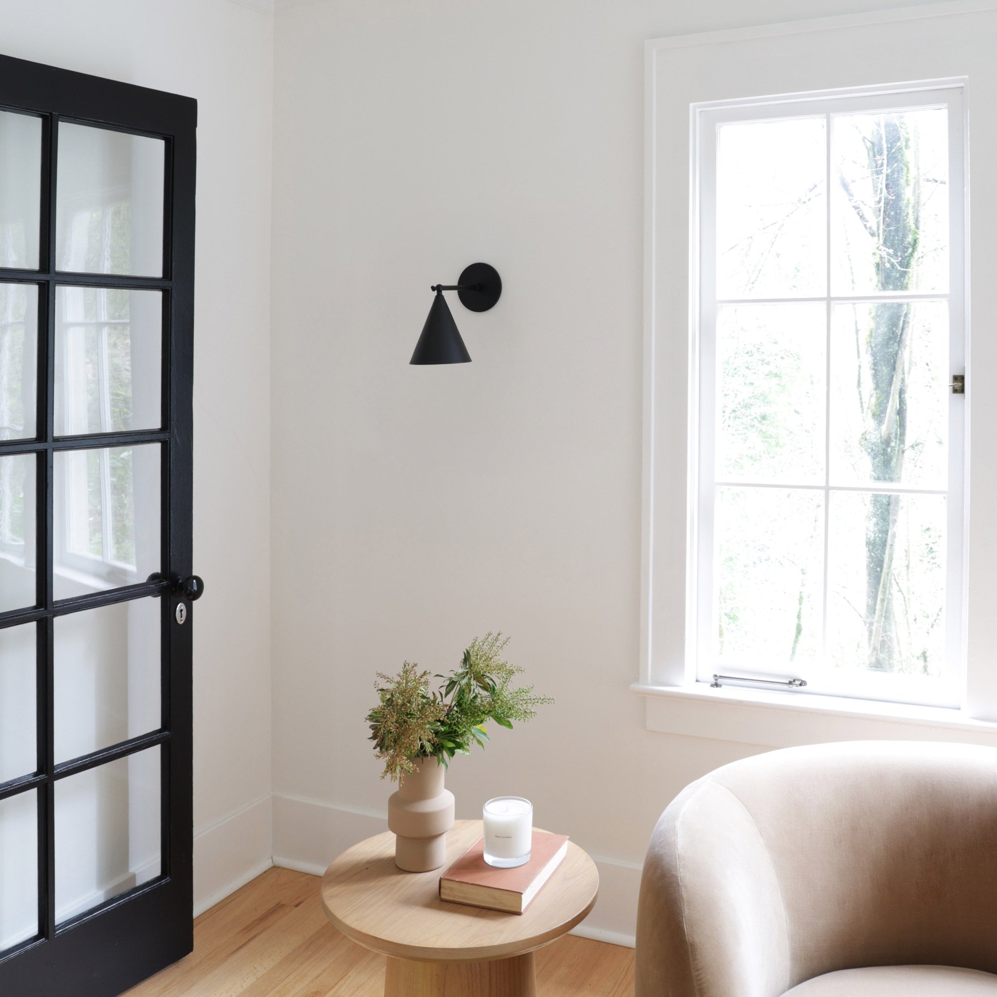 Petra Sconce shown in Matte Black with a 6" arm