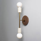 Verona shown in Bone ceramic finish with Heirloom Brass metal with Walnut canopy