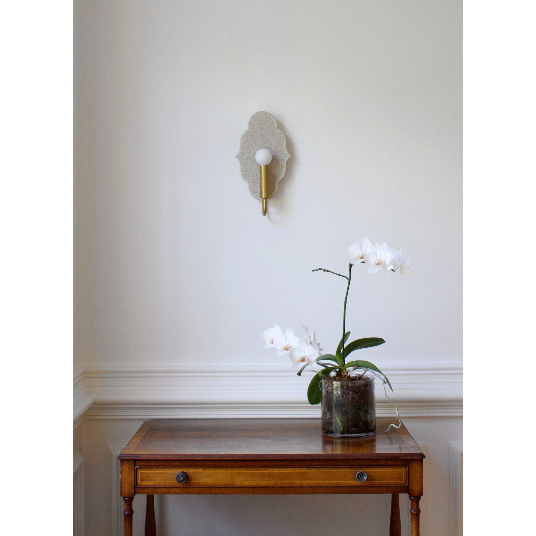 Clare Ceramic Sconce shown in Heirloom Brass with a Gloss Crackle Glaze 