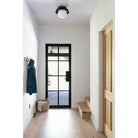 Lexi Large 8” shown with a Solid shade in Matte Black and Black Stained finish canopy