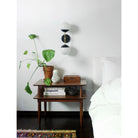 Theo shown in Matte Black and Brass with Opal 6" globes