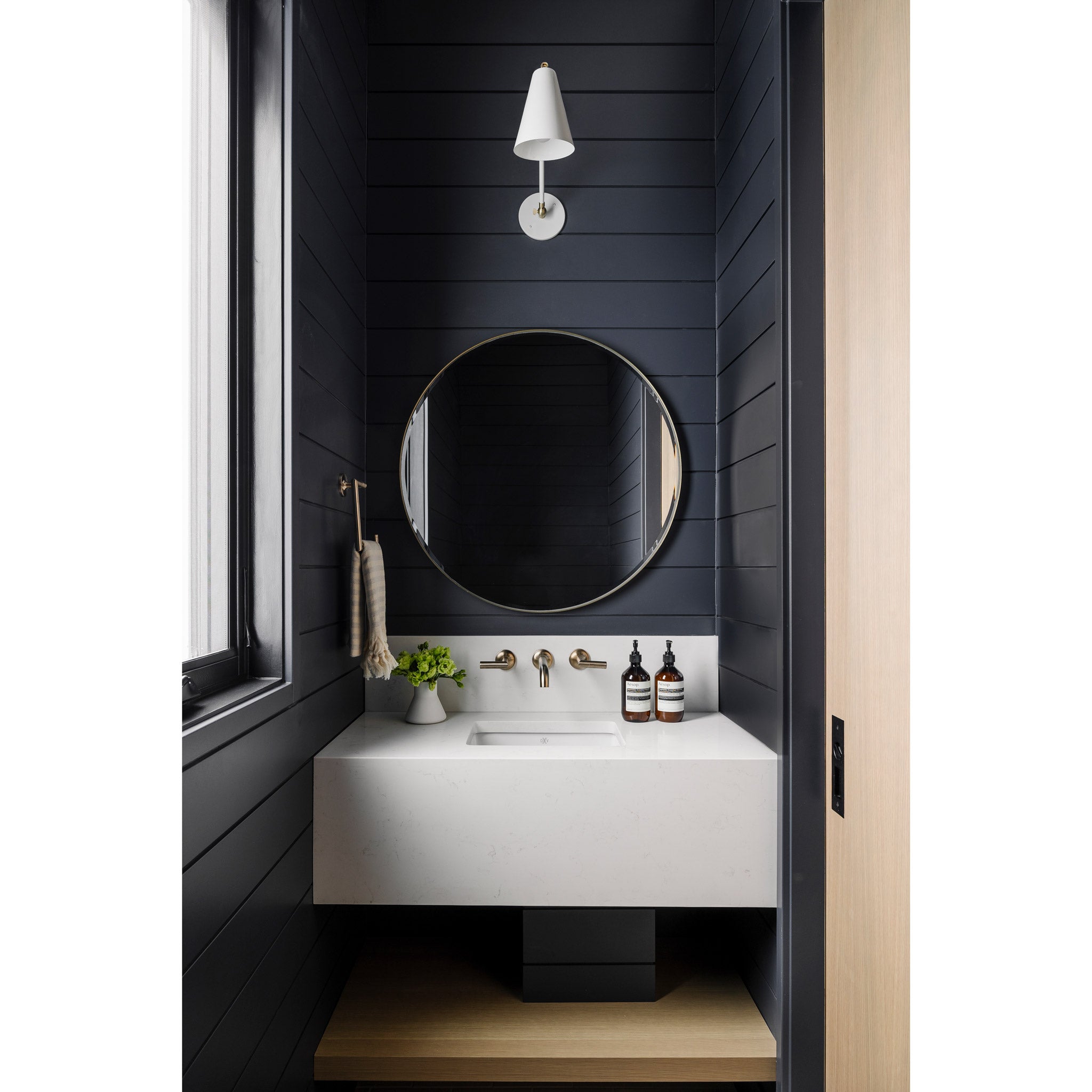 Tilt Cone Single Articulated in White with  Brass. Interior design by Alykhan Velji Designs