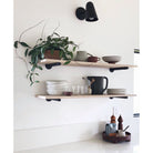 Wildwood with Wood Canopy shown in Matte Black. Interior Design by Courtney Nye Design