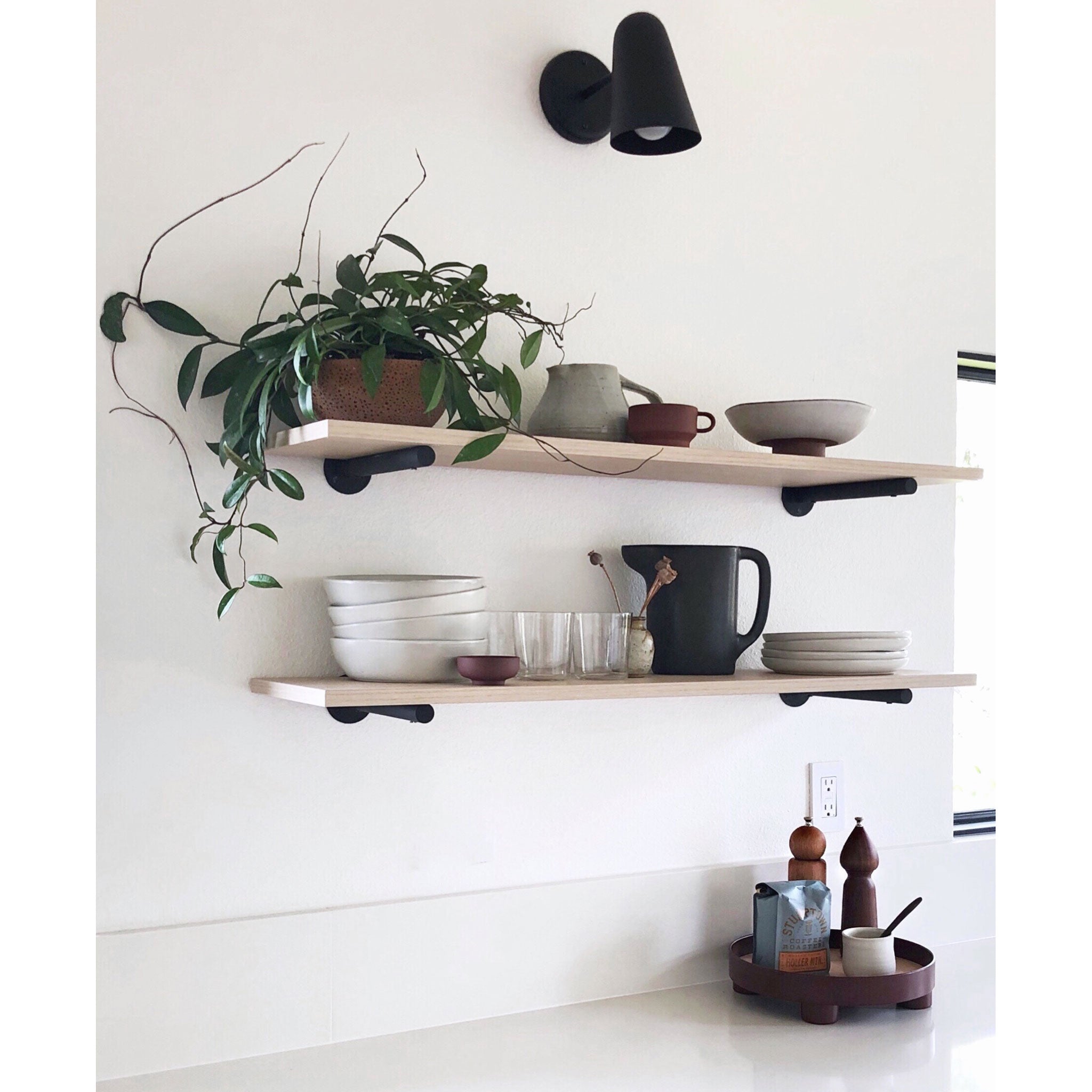 Wildwood with Wood Canopy shown in Matte Black. Interior Design by Courtney Nye Design