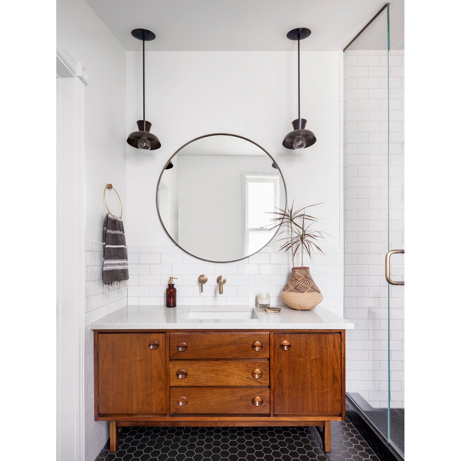 Isle Rod Pendant shown in Graphite Patina. Interior design by Annabode Design