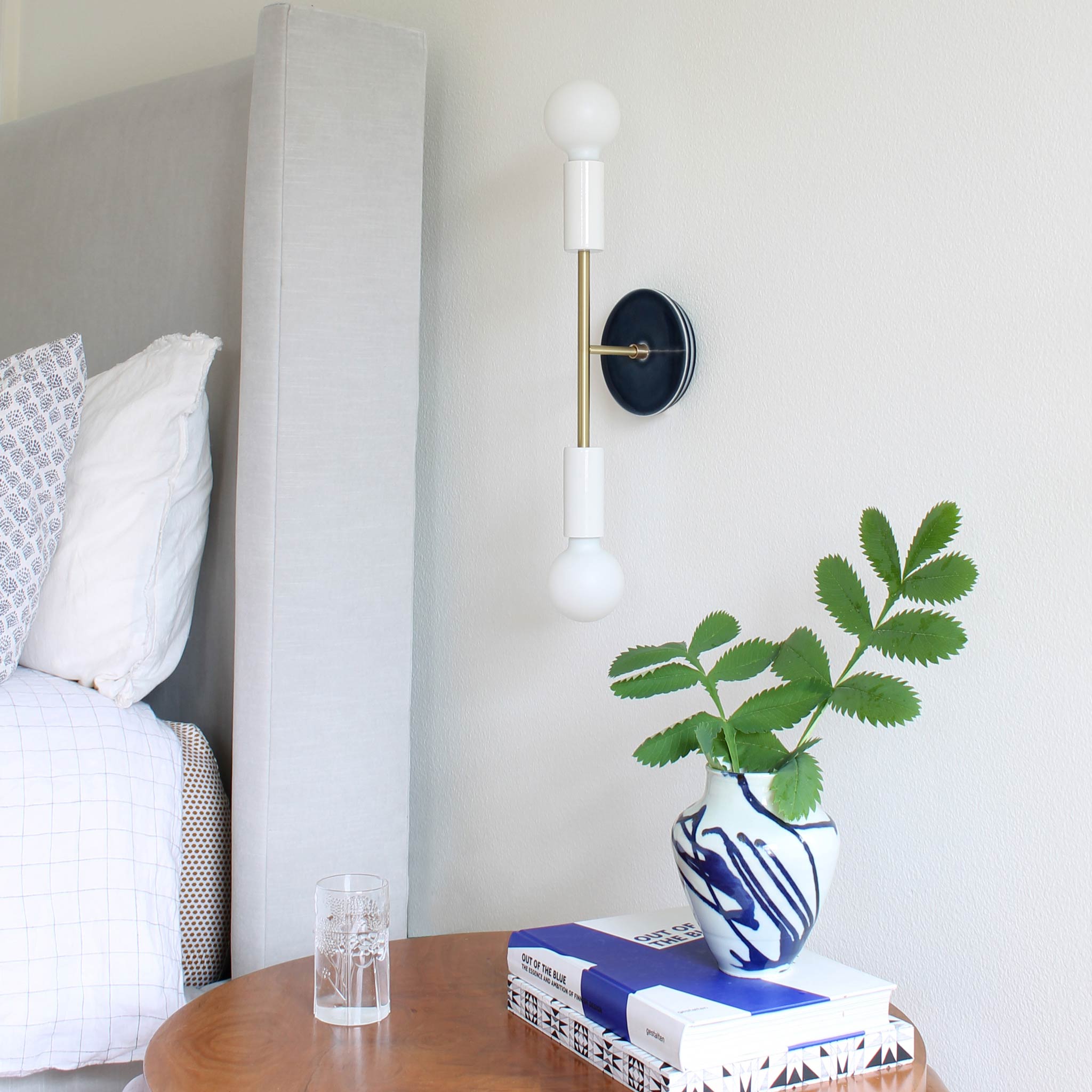 Venus Sconce shown in White with Brass with a Swift pattern  Ceramic canopy in Indigo Blue