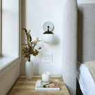 Alto Sconce 6" shown in Matte Black with a Brownstone White Sunflower Ceramic Canopy
