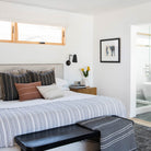 Wildwood Double Articulated in Matte Black with Brass Accents. Interior Design by Carly Waters. Photo by Tessa Neustadt