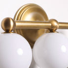 Eleanor Triple shown in Heirloom Brass