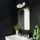 Terra Sconce shown in Bone ceramic finish with Matte Black metal. Interior Design by Zoe Feldman Design, Photo by Stacy Zarin Goldberg