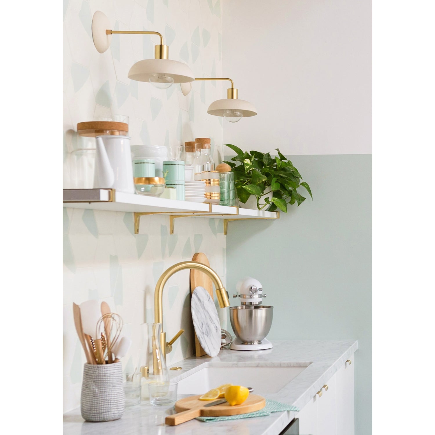 Terra Sconces in Bone ceramic finish with Brass metal. Design by Joy Cho and Sarah Sherman Samuel, Photo by Monica Wang