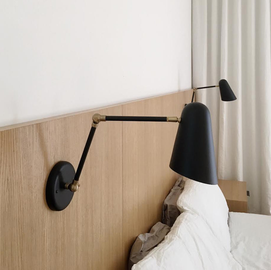 Wildwood Double Articulated shown in Matte Black with Brass Accents. Interior Design by Paige Geffen. Photo by Lauren Moore