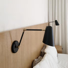 Wildwood Double Articulated shown in Matte Black with Brass Accents. Interior Design by Paige Geffen. Photo by Lauren Moore