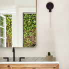 Tilt Sconce shown in Matte Black. Interior Design by Byrdesign. Photo by Heidi's Bridge